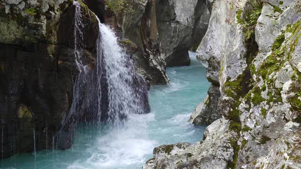 Small waterfall pouring into the Soca River