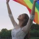 Asian Lesbian Girl Raising LGBT Rainbow Flag In The Park. - VideoHive Item for Sale
