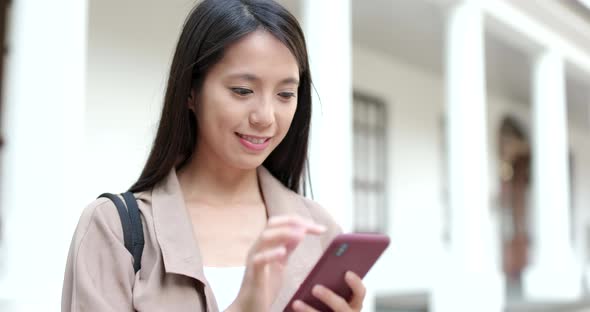 Woman use of mobile phone for online