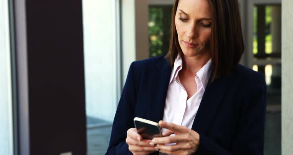 Businesswoman using mobile phone 4k