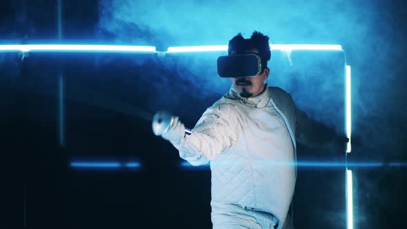 A Man in VRglasses is Having a Fencing Practice