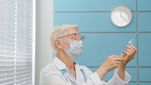 Mature grey haired woman doctor with spectacles