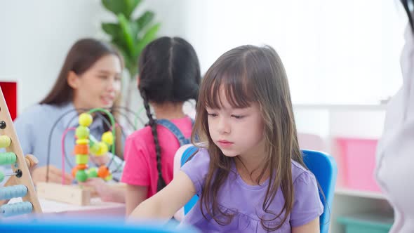 Adorable preschool children feeling happy and smile while study lesson at preschool kindergarten.