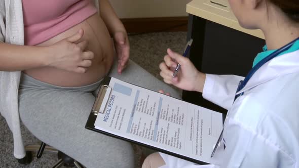 Pregnant Woman and Gynecologist Doctor at Hospital