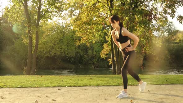 Woman Training Fitness in Park