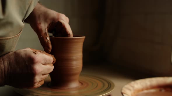 Unknown Clay Artist Sculpting in Studio