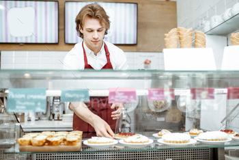 Salesman working at the pastry shop / Photodune, Misc