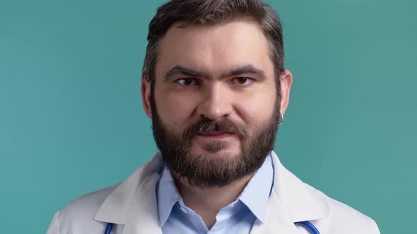 Satisfied Doctor Man in Medical Coat Nods Head Approvingly