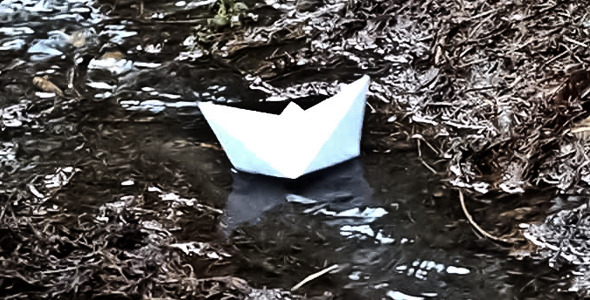 Paper Ship Floating On A Stream