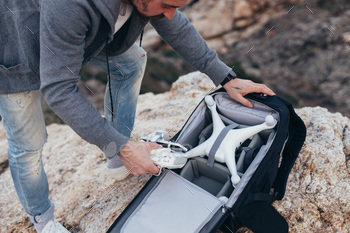 npacks backpack with photography equipment and drone. Ready to shoot aerial footage for sale or social media