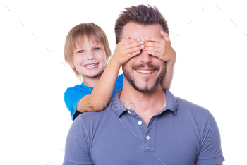 eyes with hands and smiling while both standing isolated on white background