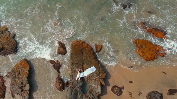 Aerial Drone View of Young Woman on Beach Top Above