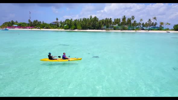 Romantic couple happy together on relaxing sea view beach wildlife by blue water and white sandy bac