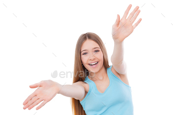 g out hands and smiling while standing isolated on white