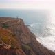 Rugged Coastline At Atlantic Ocean Morning, Foliage And Cabo Da Roca Lighthouse - VideoHive Item for Sale
