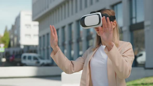 Woman on Headset Testing Virtual Reality Near Office Center