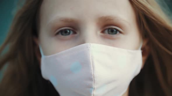 Close Up of Face of Female Child in Medical Pink Mask, Protection From Corona Virus, Back To School