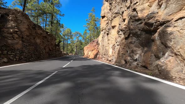 Long asphalt road ground view with sunset light and travel concept - mountain and sky