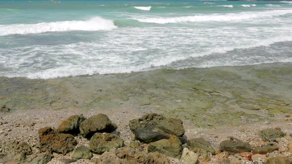 Sea Waves break over stone 