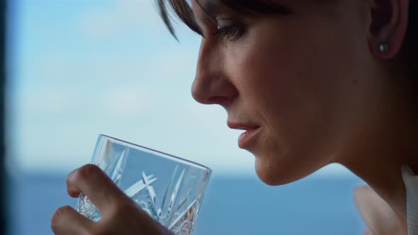 Depressed Woman Holding Alcohol Glass Closeup