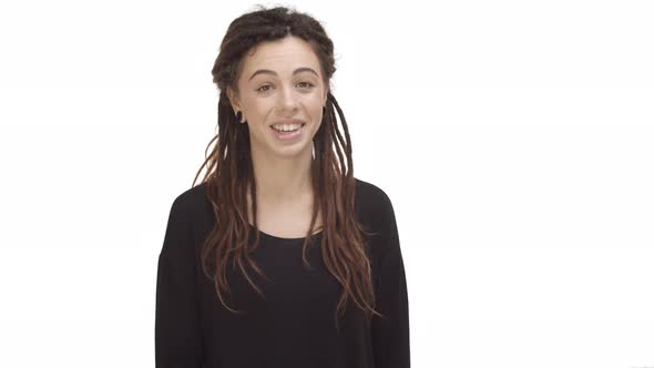 Video of Beautiful Modern Woman with Dreadlocks and Ear Tunnels Agree with you Nodding and Saying