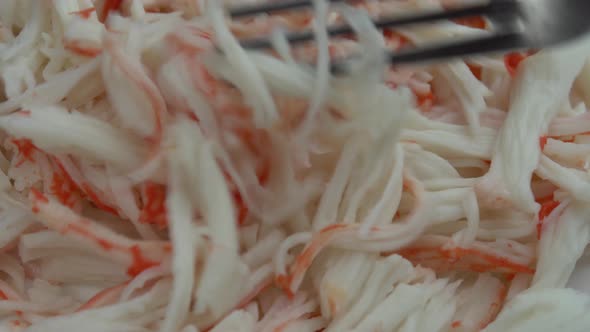 Chopped Crab Meat is Pricked with a Fork Delicious and Juicy Crab Meat Rotates on a Plate Crab