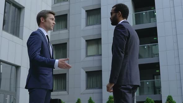 Male Boss Talking to Company Worker Outdoors, Business Relations, Discussion