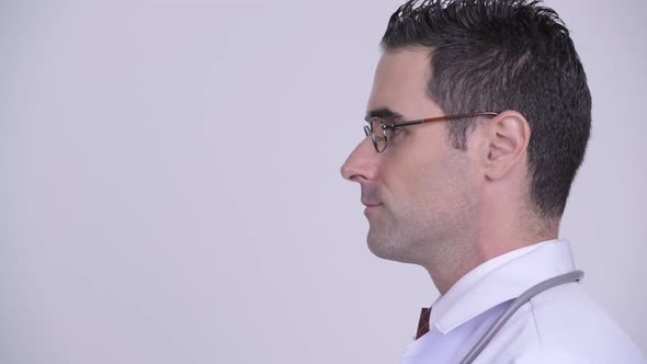 Head Shot Profile View of Handsome Man Doctor Wearing Eyeglasses