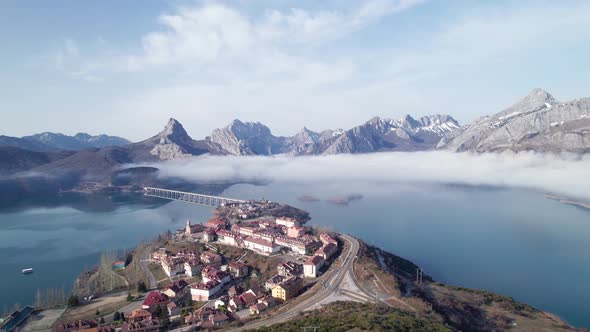 Paradise, huge lake near to a little village in León, Spain. Mist above a clear blue lake on a beaut