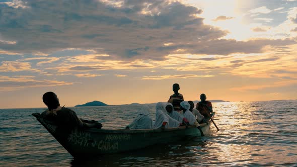 Skiff on Lake Victoria at Sunset