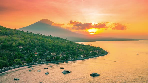 Top View of Amed, Jemeluk Bay and Volcano Agung at Sunset in Bali, Indonesia. Aerial Timelapse 