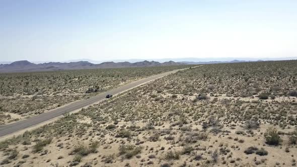 The infinity of the desert in the background mountainsUnbelievable aerial view flight panorama curv