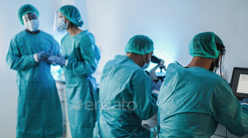 Medical workers in hazmat suit working with laptop computer and micoroscope inside laboratory / Photodune, Misc
