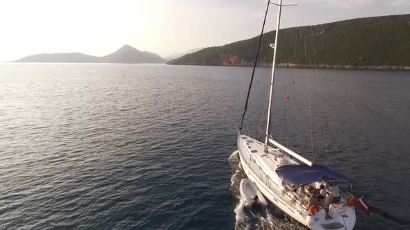 White Sailing Yacht Sails Past Peninsula Montenegro