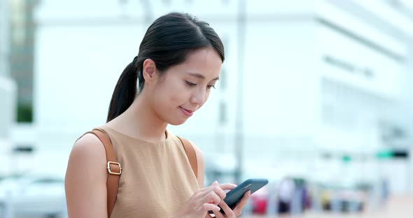 Woman use of mobile phone online