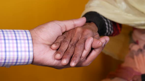 Doctor Holding Hand of a Senior Women