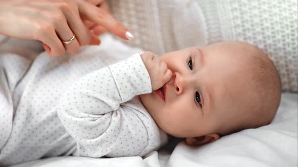 Cute Toddler Thumb Sucking Lying on Bed Trying Sleeping