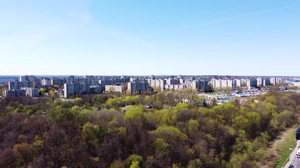 Urban cityscape of block apartment buildings, aerial ascend view