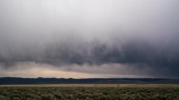 Timelapse of rain falling from the clouds over the Wyoming landscape in Spring