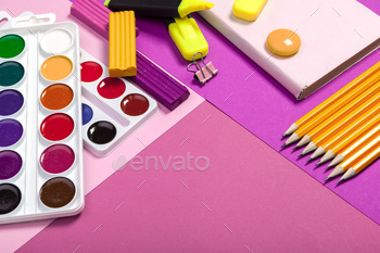 school supplies at abstract colorful background texture / Photodune