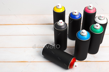 Spray paint cans close up. creative photo / Photodune