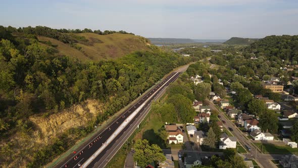 Bluffs next to a road in Red wing Minnesota during summer time aerial footage