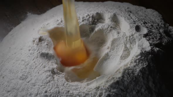 Egg Falls Onto Flour