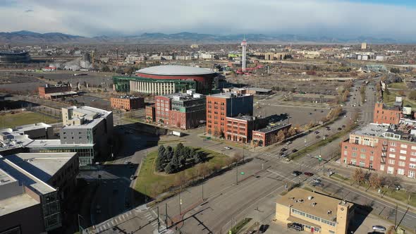 we pan along several Denver landmarks as clouds hug the local mountains