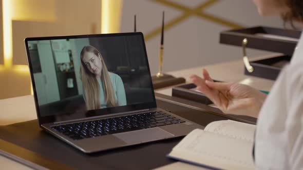 Counselor at Laptop During Online Consultation