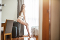 Definitely stunning. Sexy young woman in hotel room. Copy space on the right side - PhotoDune Item for Sale