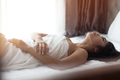 Young woman in bedroom sensuality concept lying relaxed - PhotoDune Item for Sale