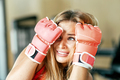 Girls can defend. Attractive female kickboxer having workout in gym - PhotoDune Item for Sale