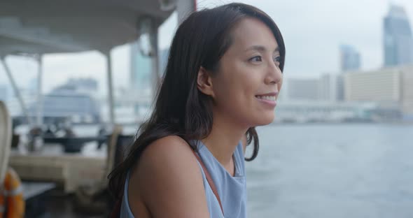 Woman take ferry in Hong Kong city