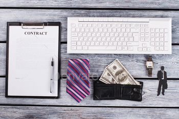 Signed contract, money and tie. / Photodune, Misc